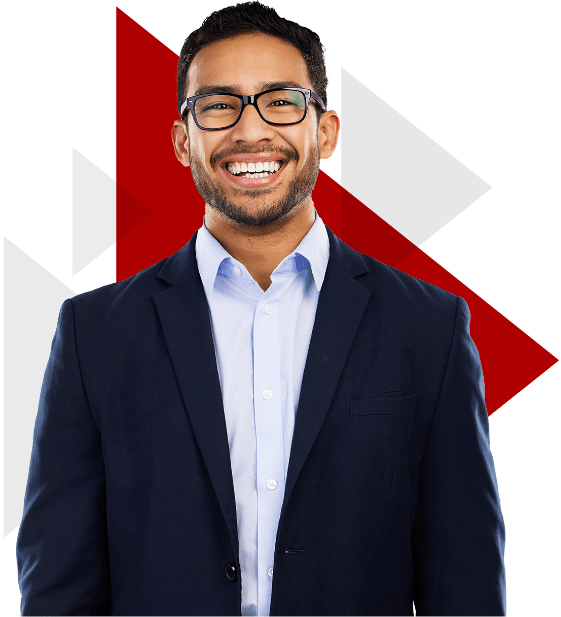 Young man in business attire smiling in front of red triangle